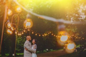 Beautiful couple in fairy lights by Bhavna Barratt Photography