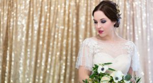 Bride in front of sparkle backdrop LND Events