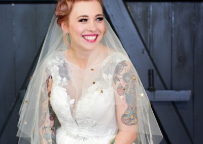 Quirky Yorkshire Wedding Venue River Mills Ballroom Tattooed bride holding bouquet