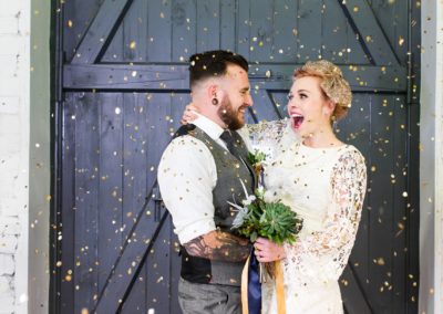 Quirky Yorkshire Wedding Venue River Mills Ballroom couple in confetti