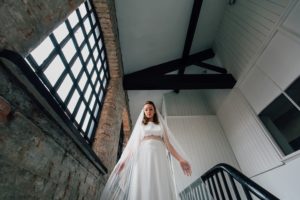 Yorkshire Wedding Venue River Mills Ballroom back staircase with bride